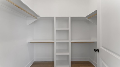 Closet space with multiple shelving.