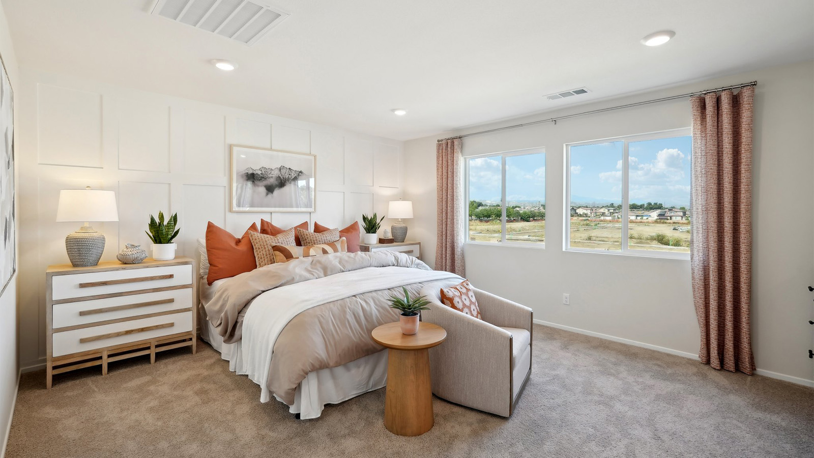 Primary bedroom with king bed and capret