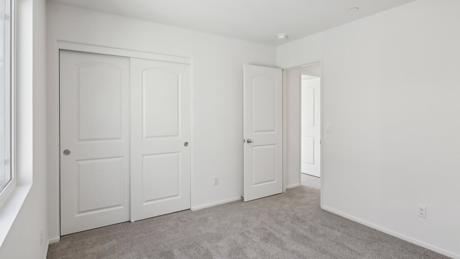 Secondary bedroom with carpet