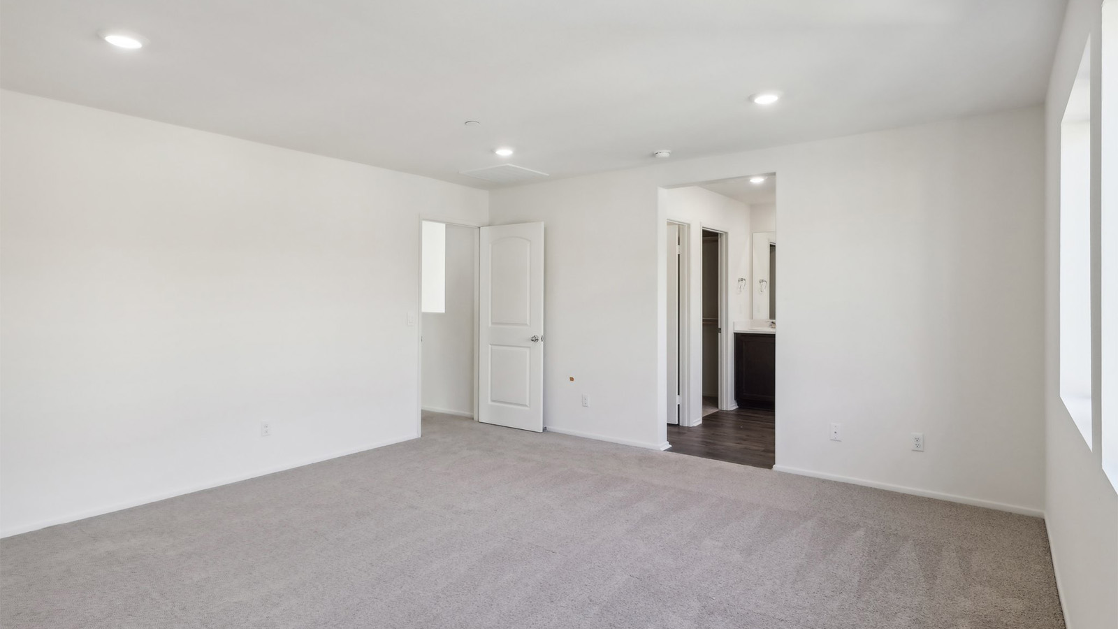 Primary bedroom with carpet