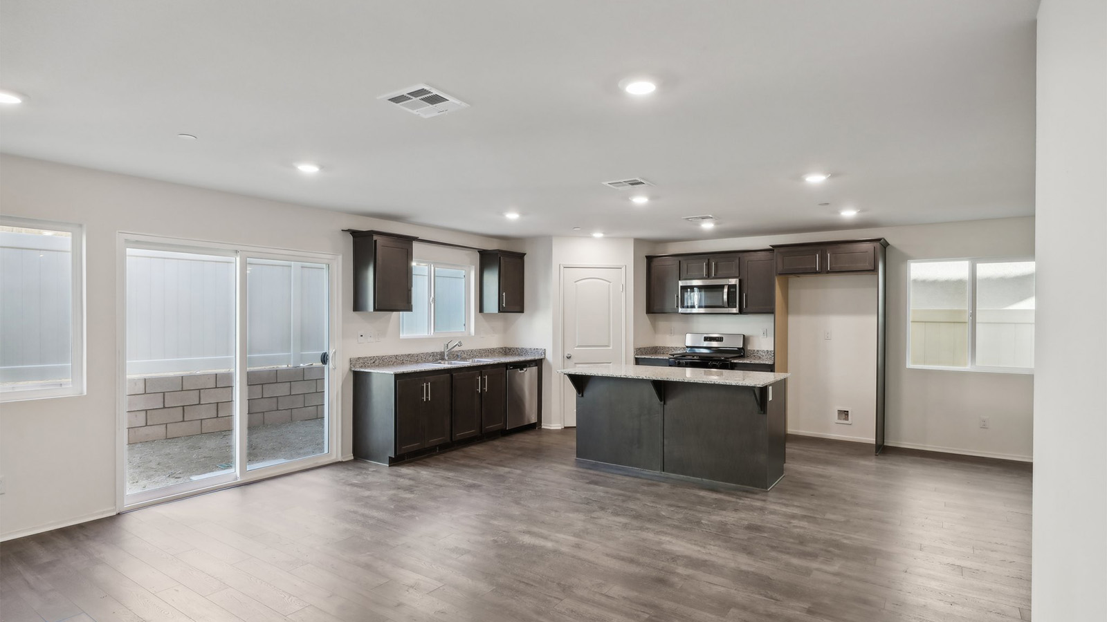 Spacious open-concept great room, dining room and kitchen