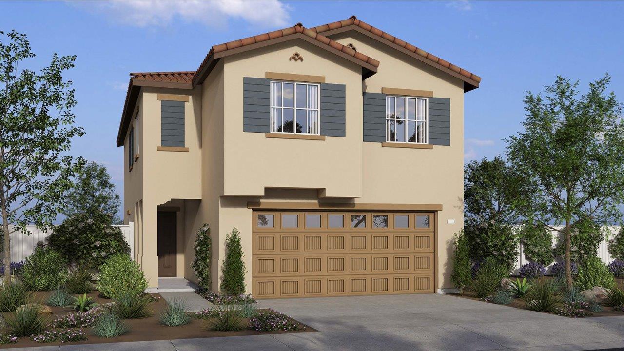 Two-story Spanish home with shutters and two car garage