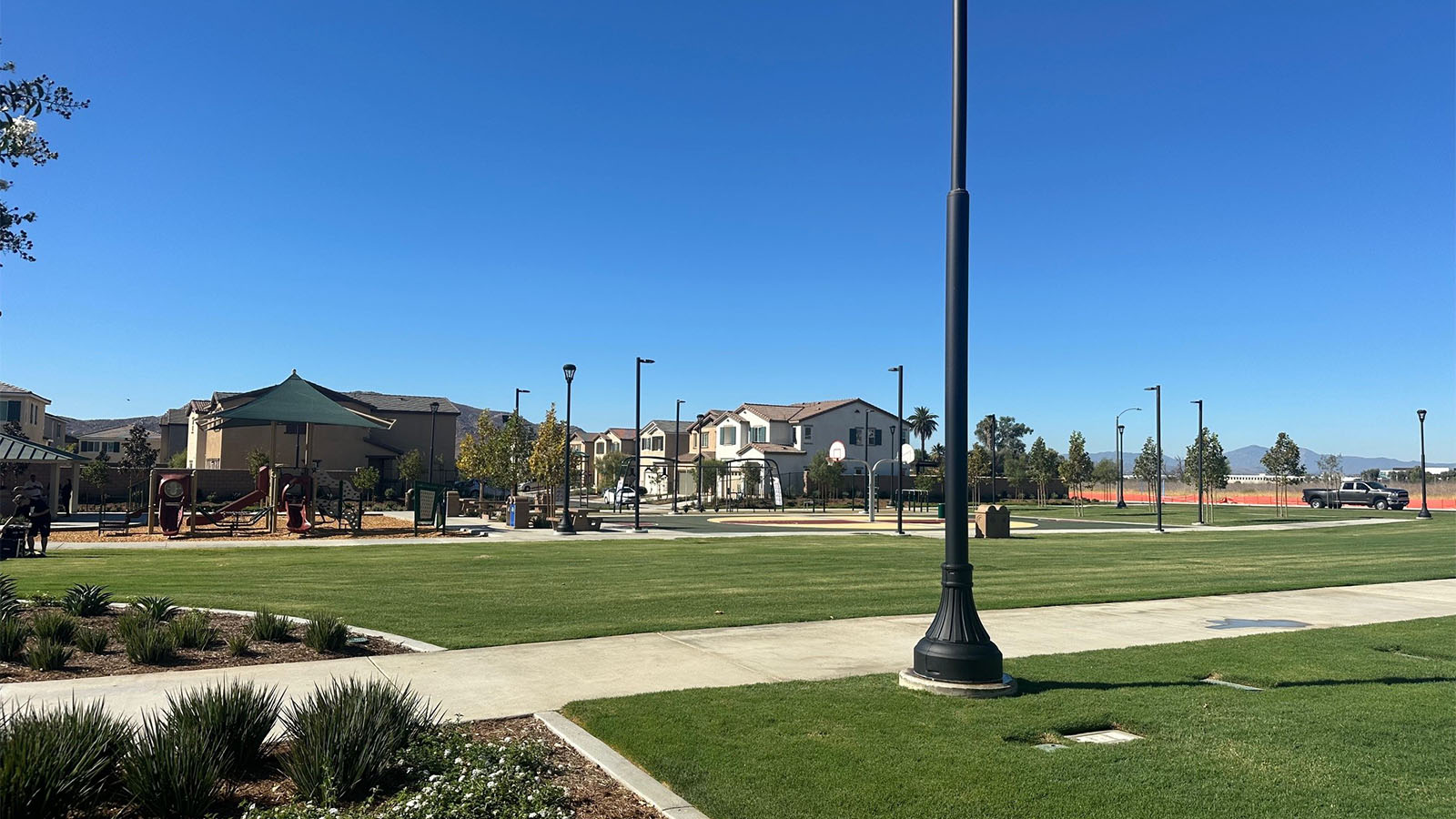 Community park open turf area and basketball court