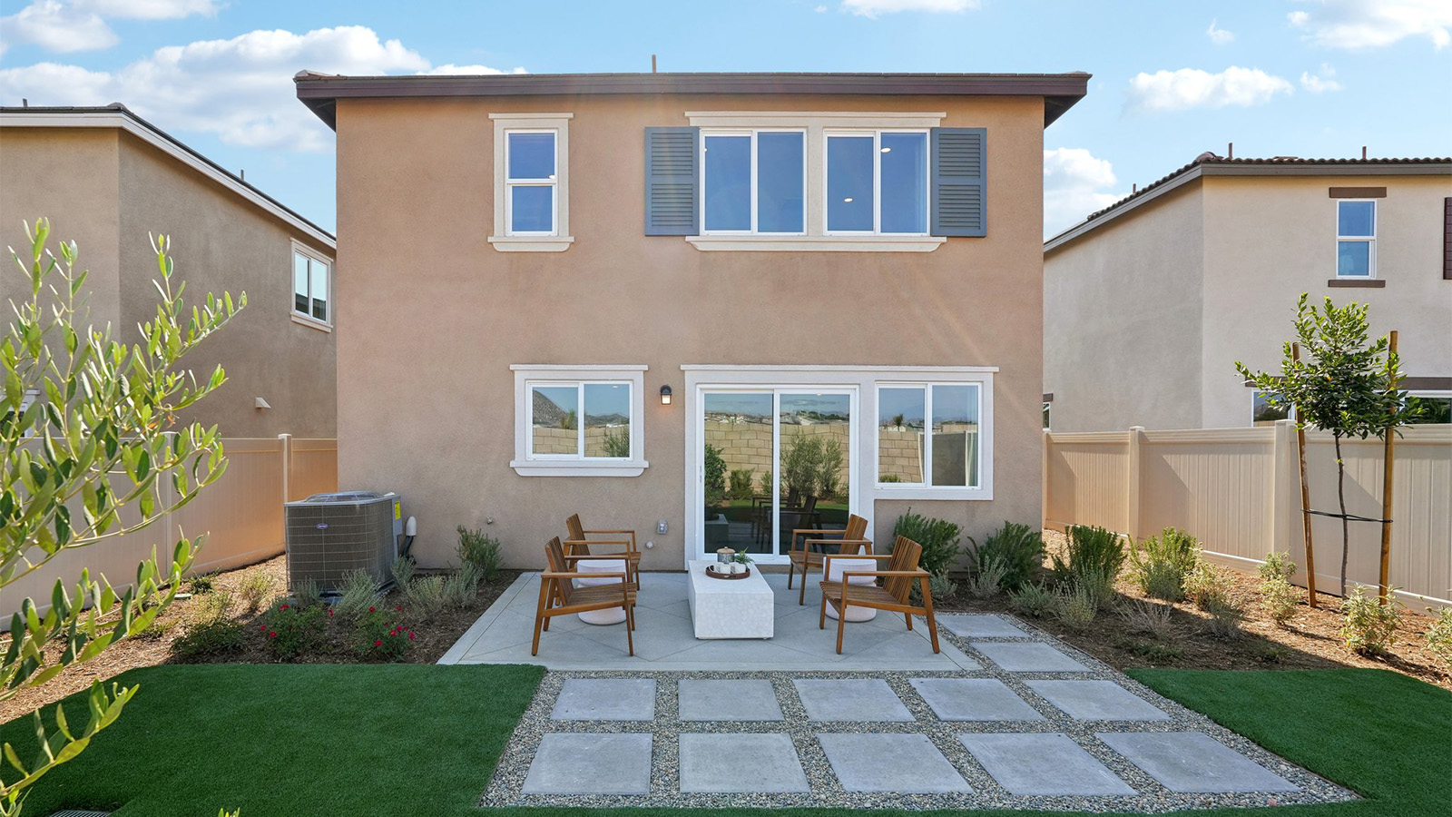 Spacious backyard with patio area and turf
