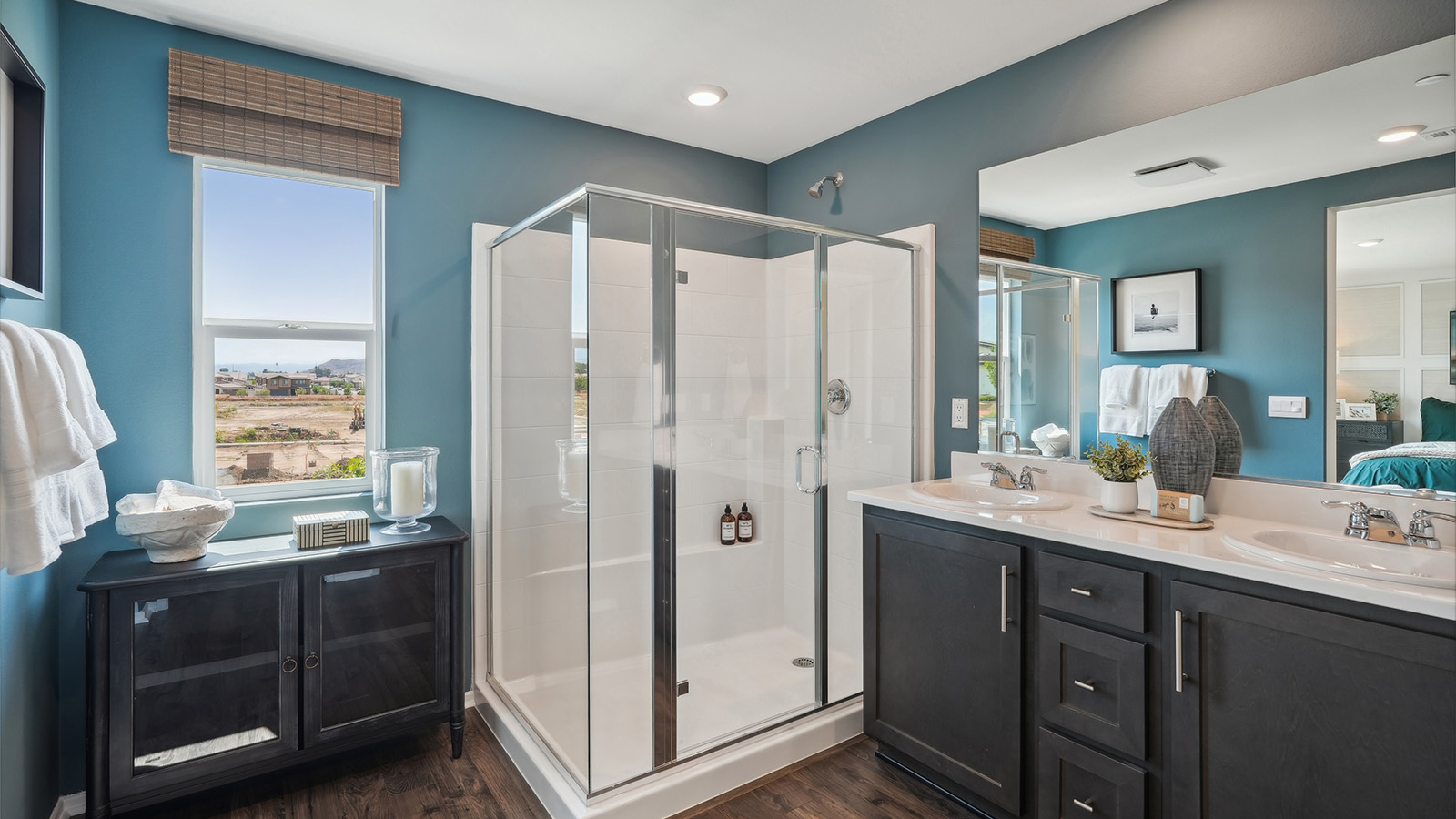 Primary bathroom with his and hers sinks and shower