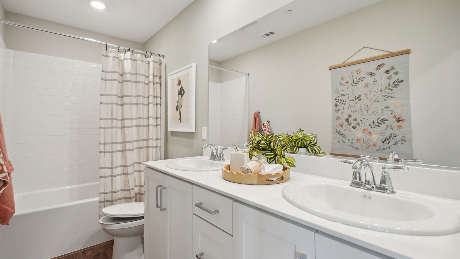 Secondary bathroom with vanity and tub shower combination
