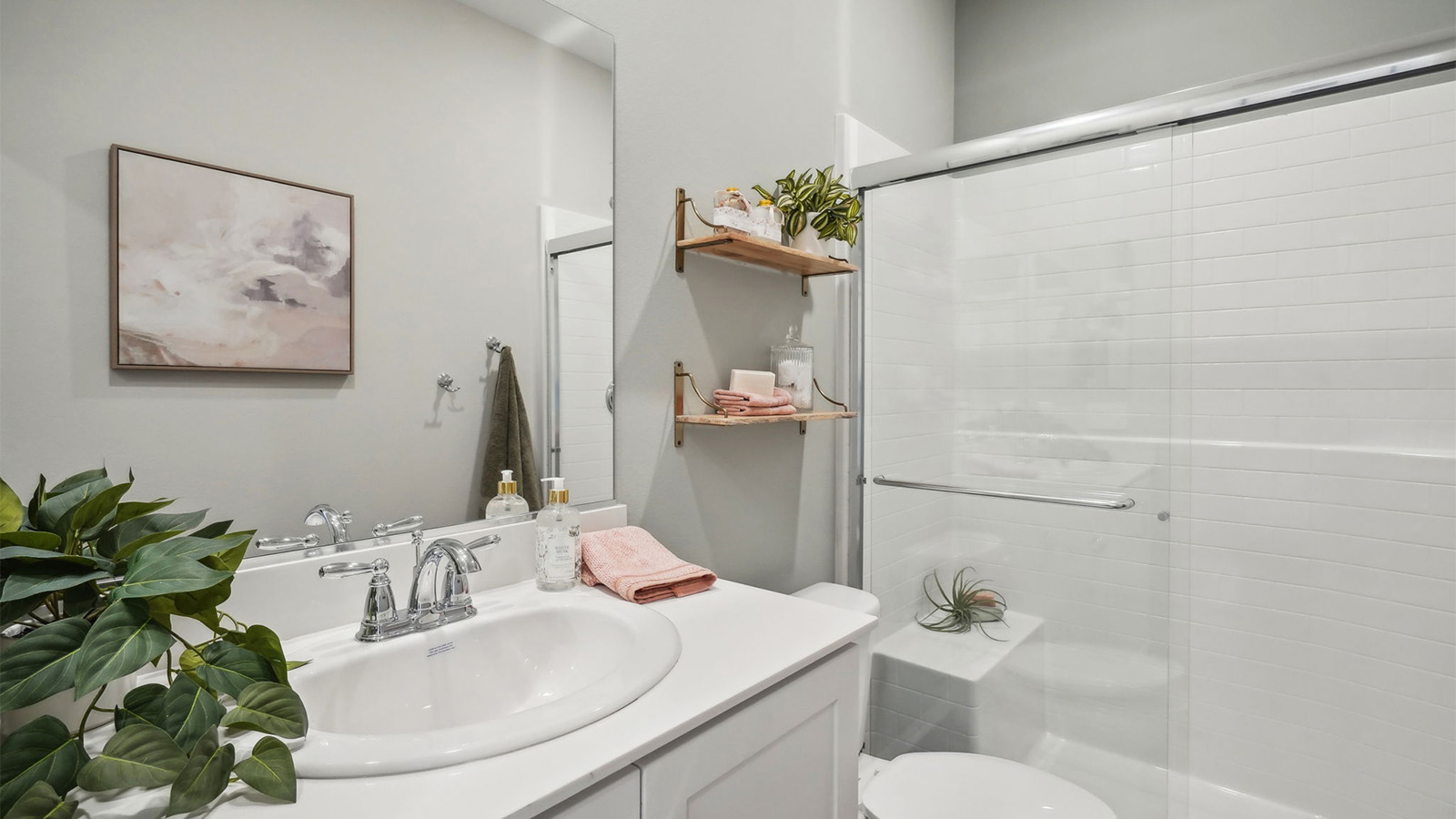 Secondary bathroom with vanity and shower