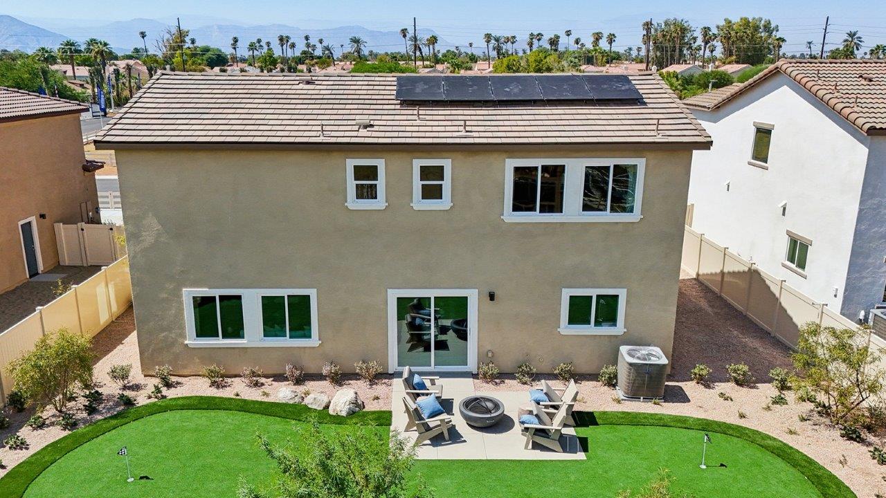 Spacious backyard with turf and patio area