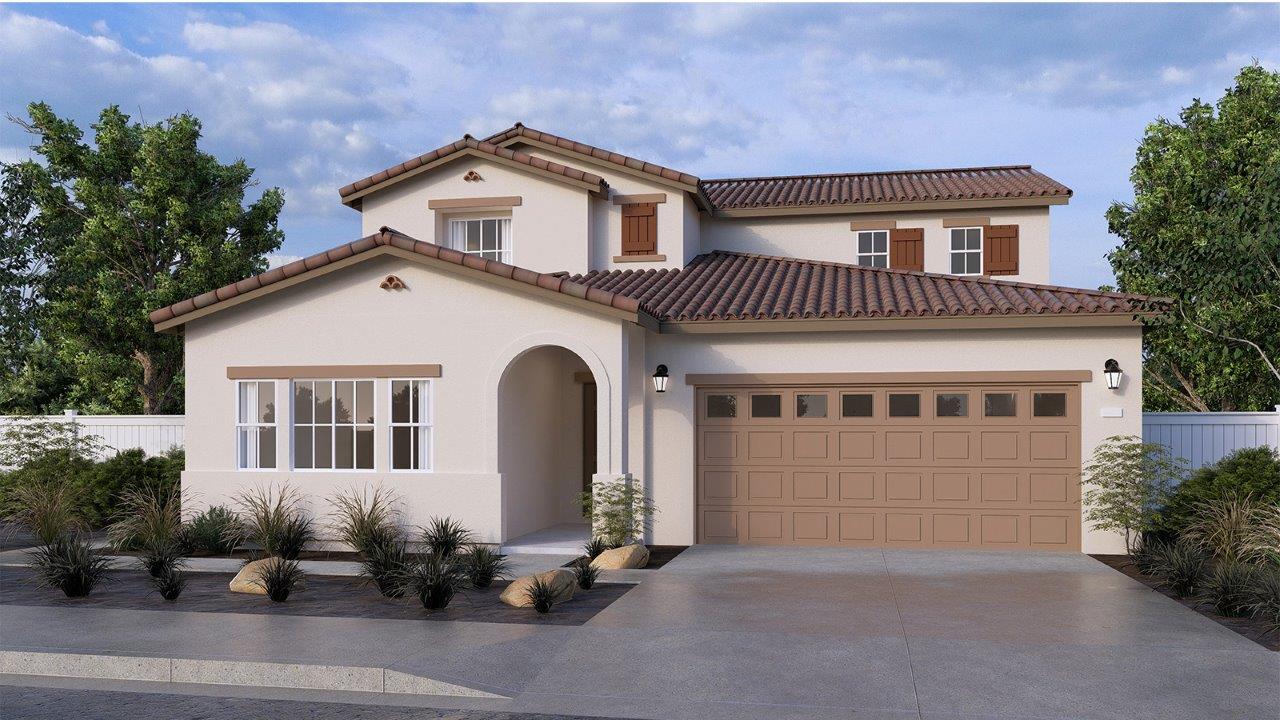Two-story Spanish home with two-car garage and shutters