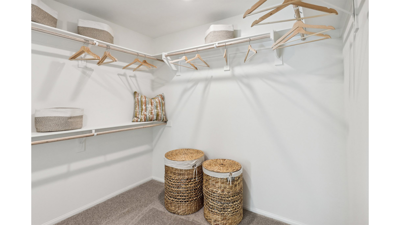 Primary bedroom walk in closet