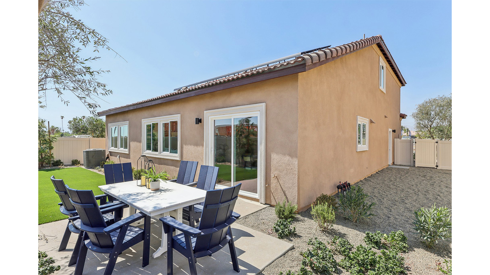 Spacious backyard with turf and patio area