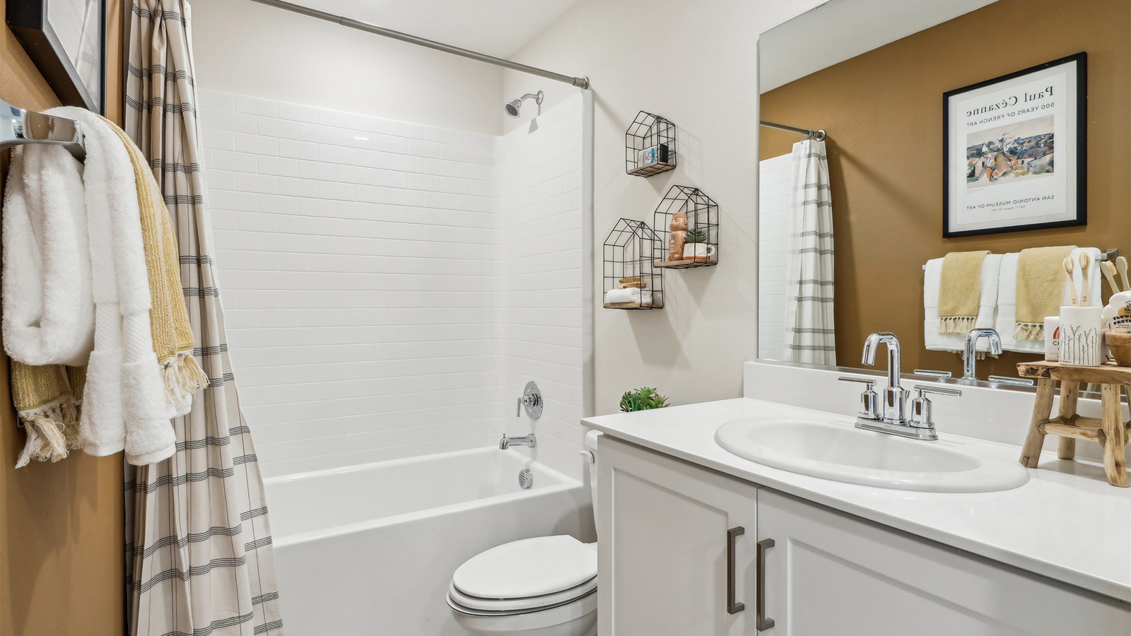 Secondary bathroom with vanity and tub shower combination