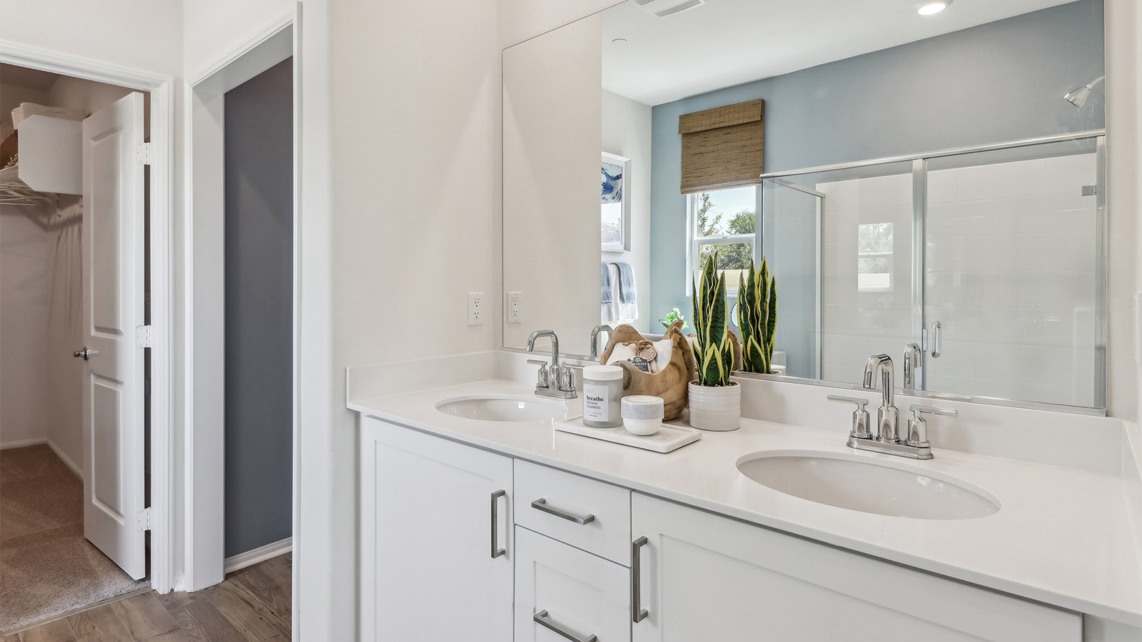 Primary bathroom with dual vanities