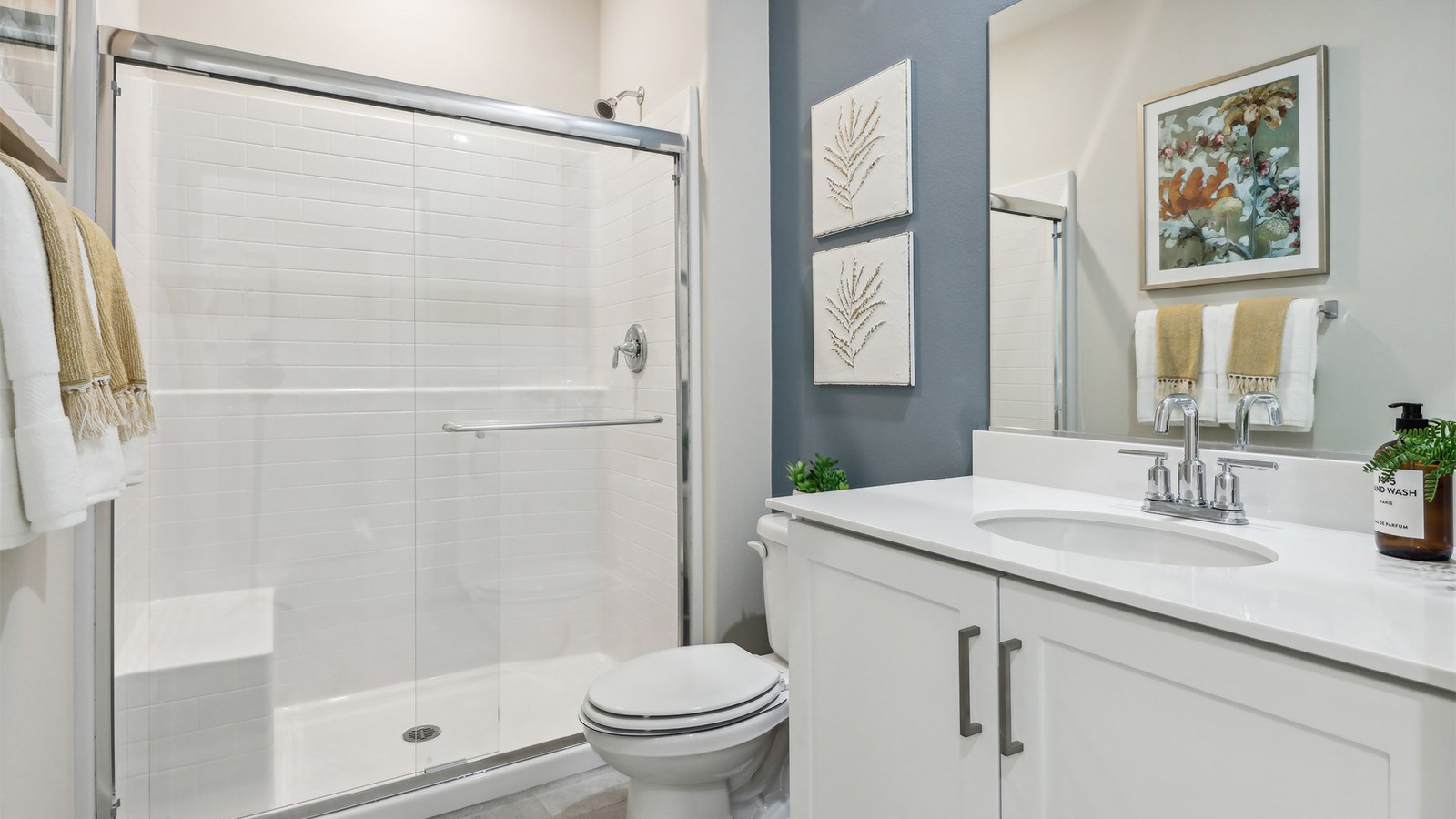 Secondary bathroom with vanity and shower