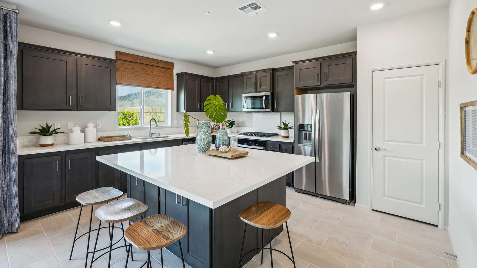 Kitchen peninsula with stainless steel appliances