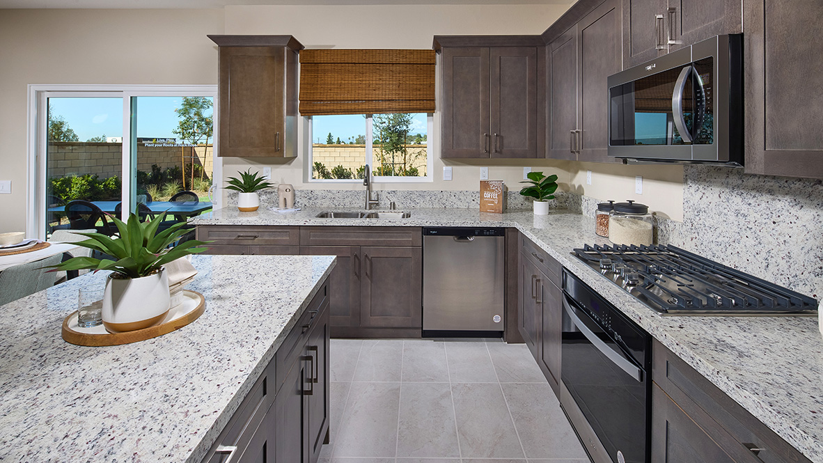 Open-concept kitchen area with granite countertops