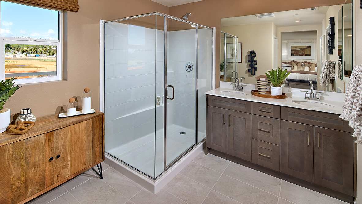 Primary bathroom with walk in shower and double sinks