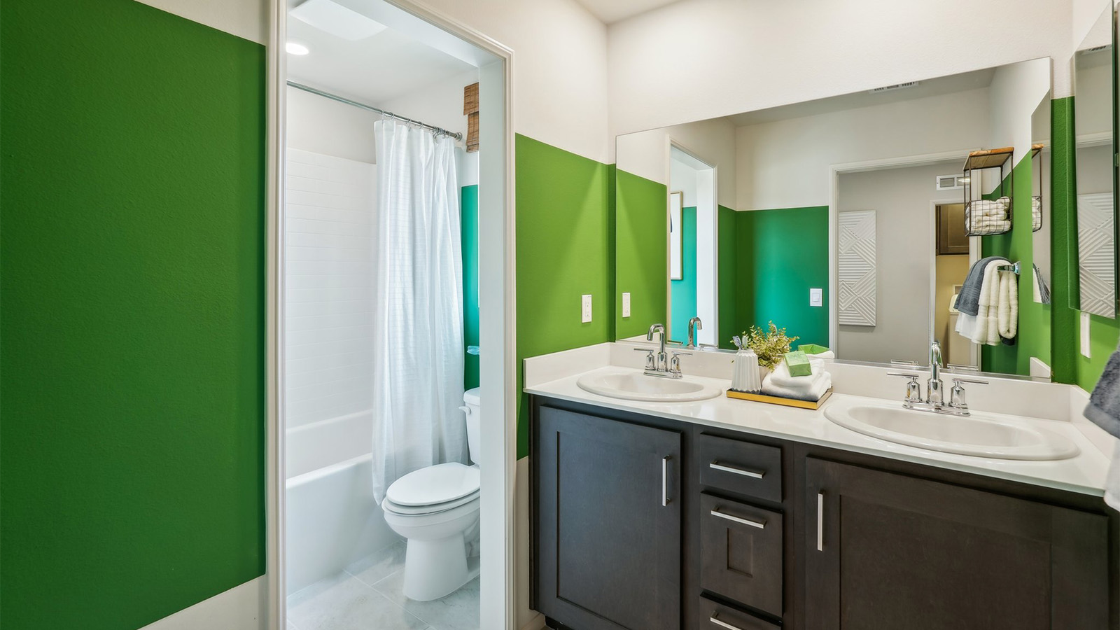 Bathroom with vanity and tub shower combination