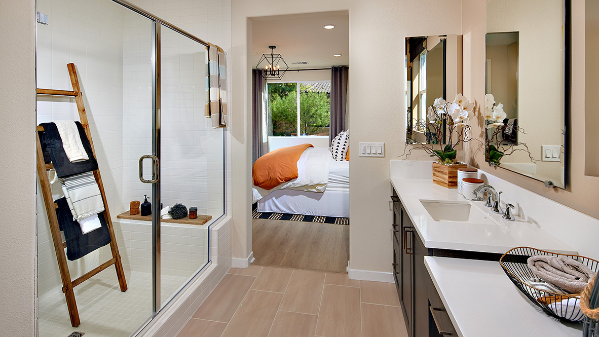 Primary bathroom with double sinks and walk-in shower