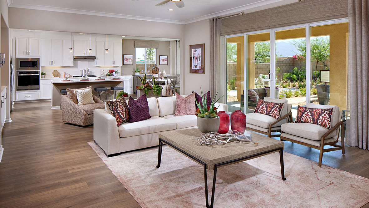 Open-concept great room and kitchen with laminate flooring