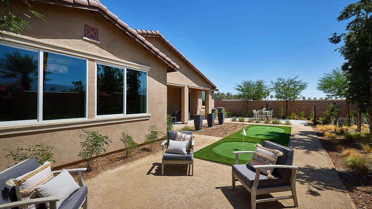 Spacious backyard with patio area with putt-putt golf area