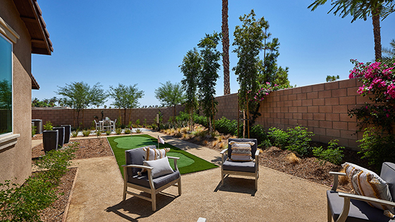 Spacious backyard with patio area with putt-putt golf area
