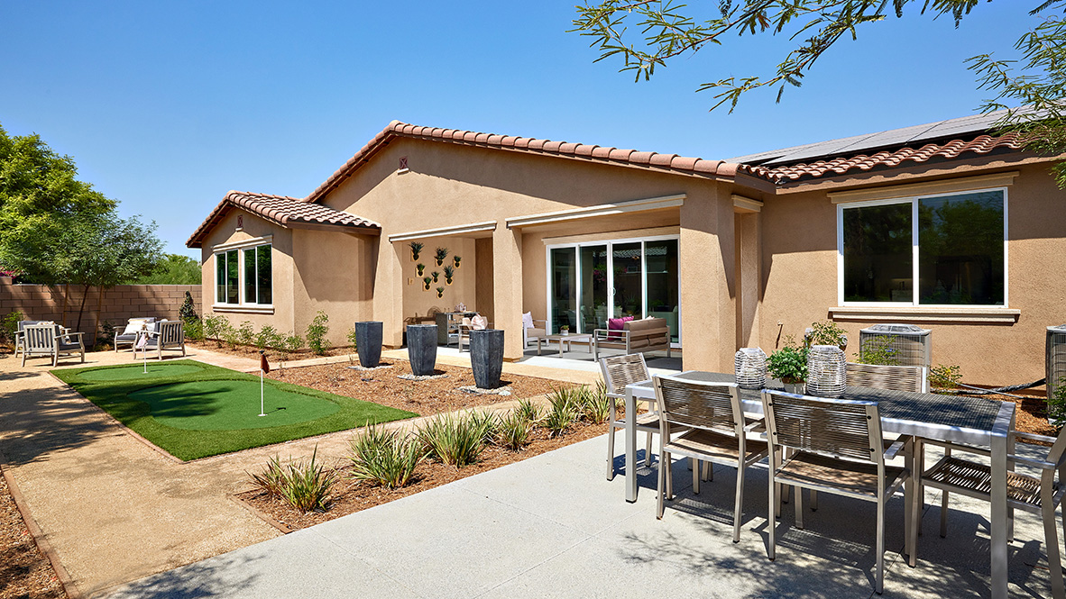 Spacious backyard with patio area with putt-putt golf area