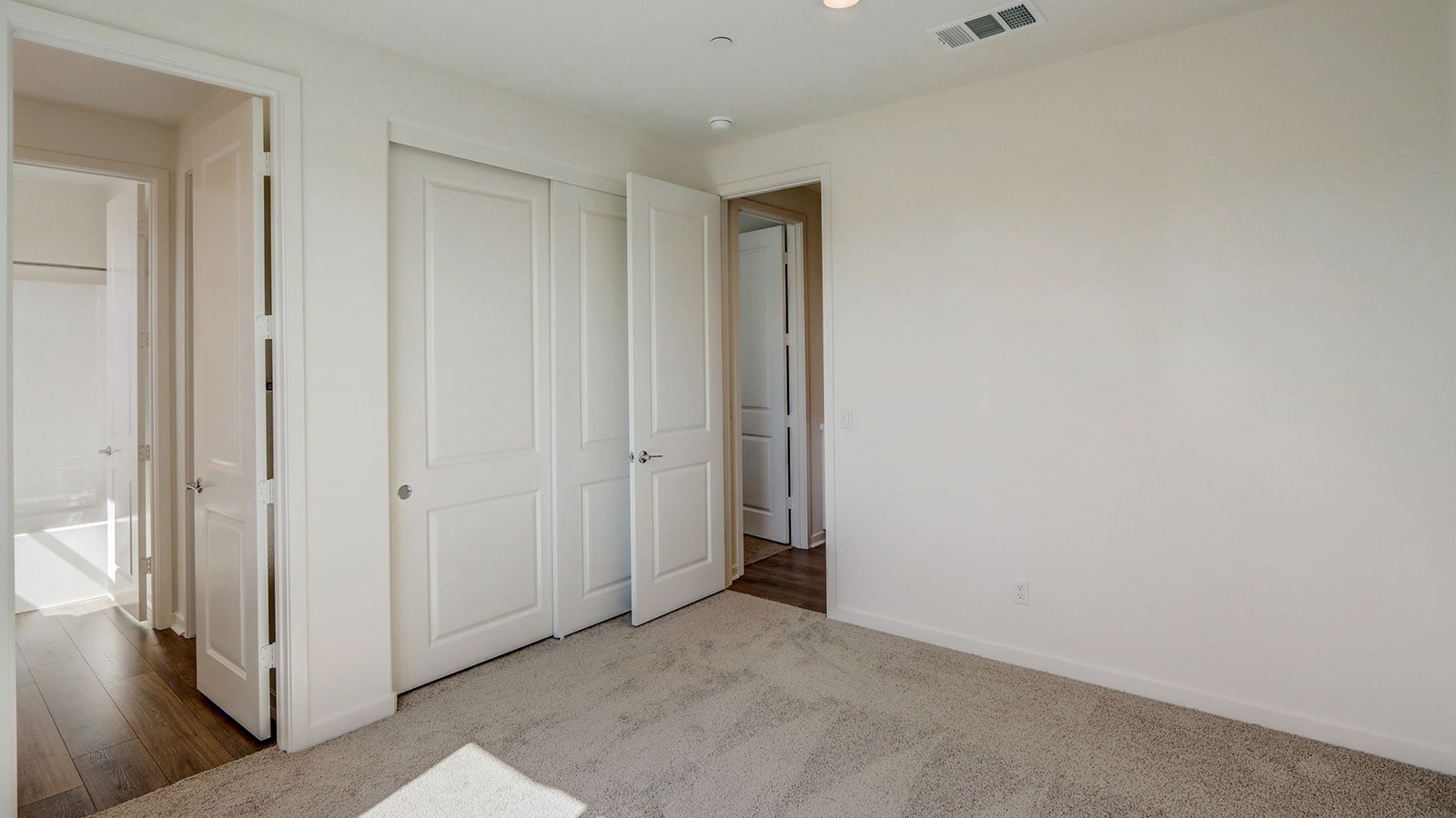 Secondary bedroom with carpet