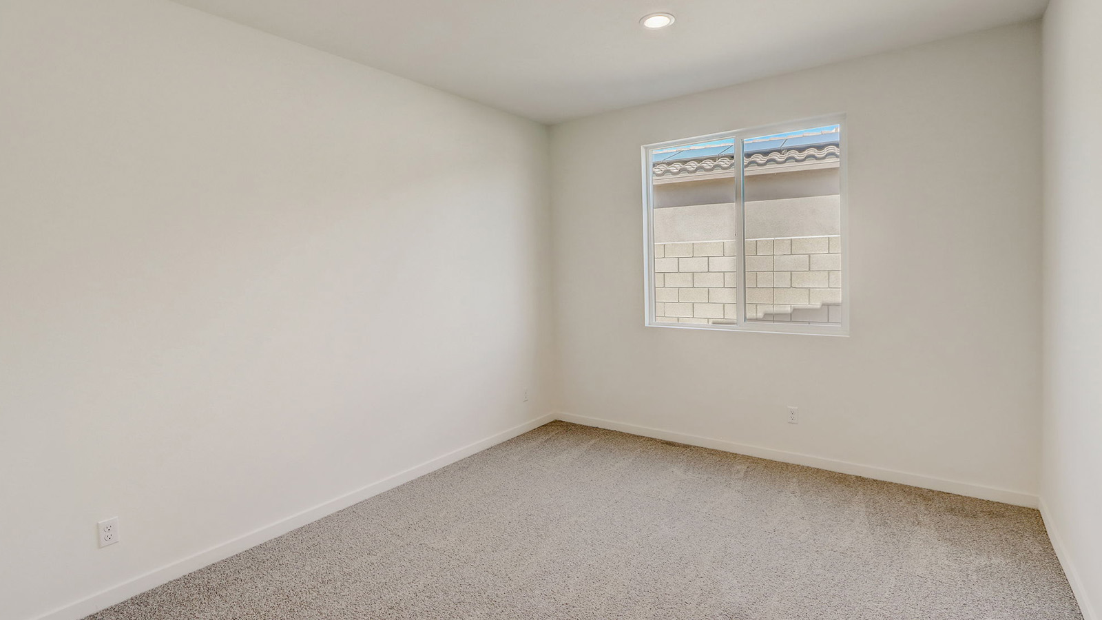Secondary bedroom with carpet