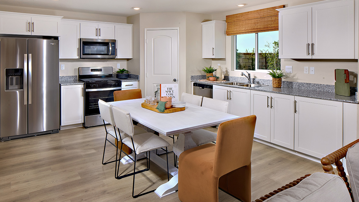 Kitchen with white cabinets and stainless steel appliances