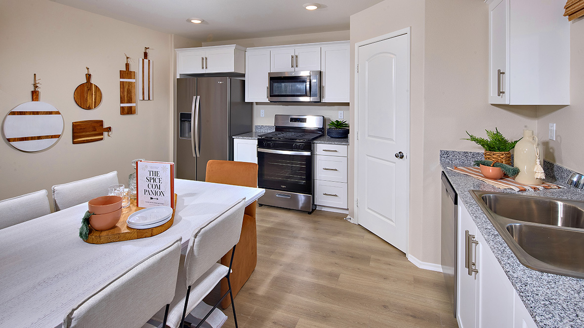 Kitchen with white cabinets and stainless steel appliances
