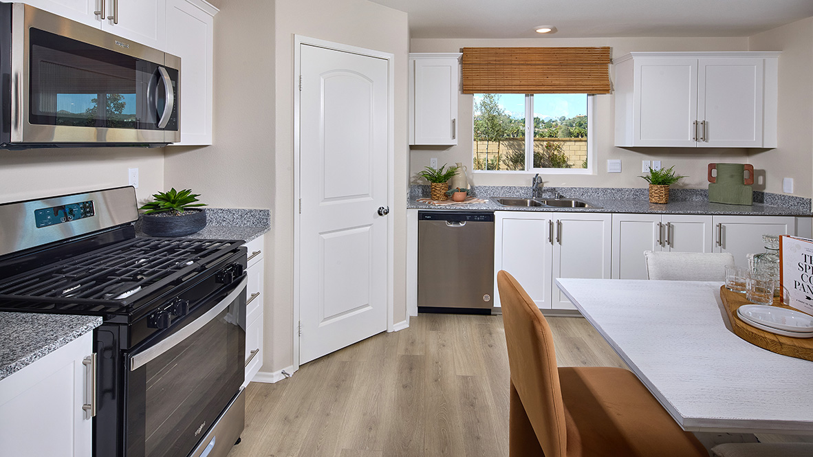 Kitchen with white cabinets and stainless steel appliances