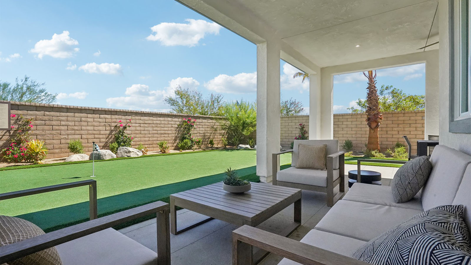 Covered California room overlooking turf area