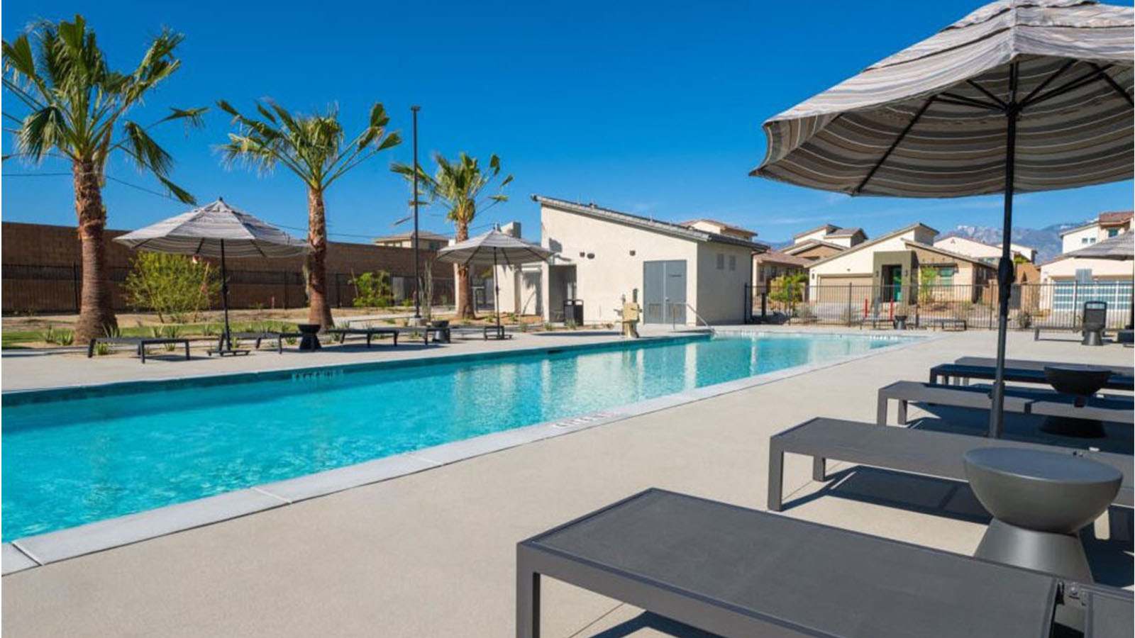 Community pool with lounge chairs