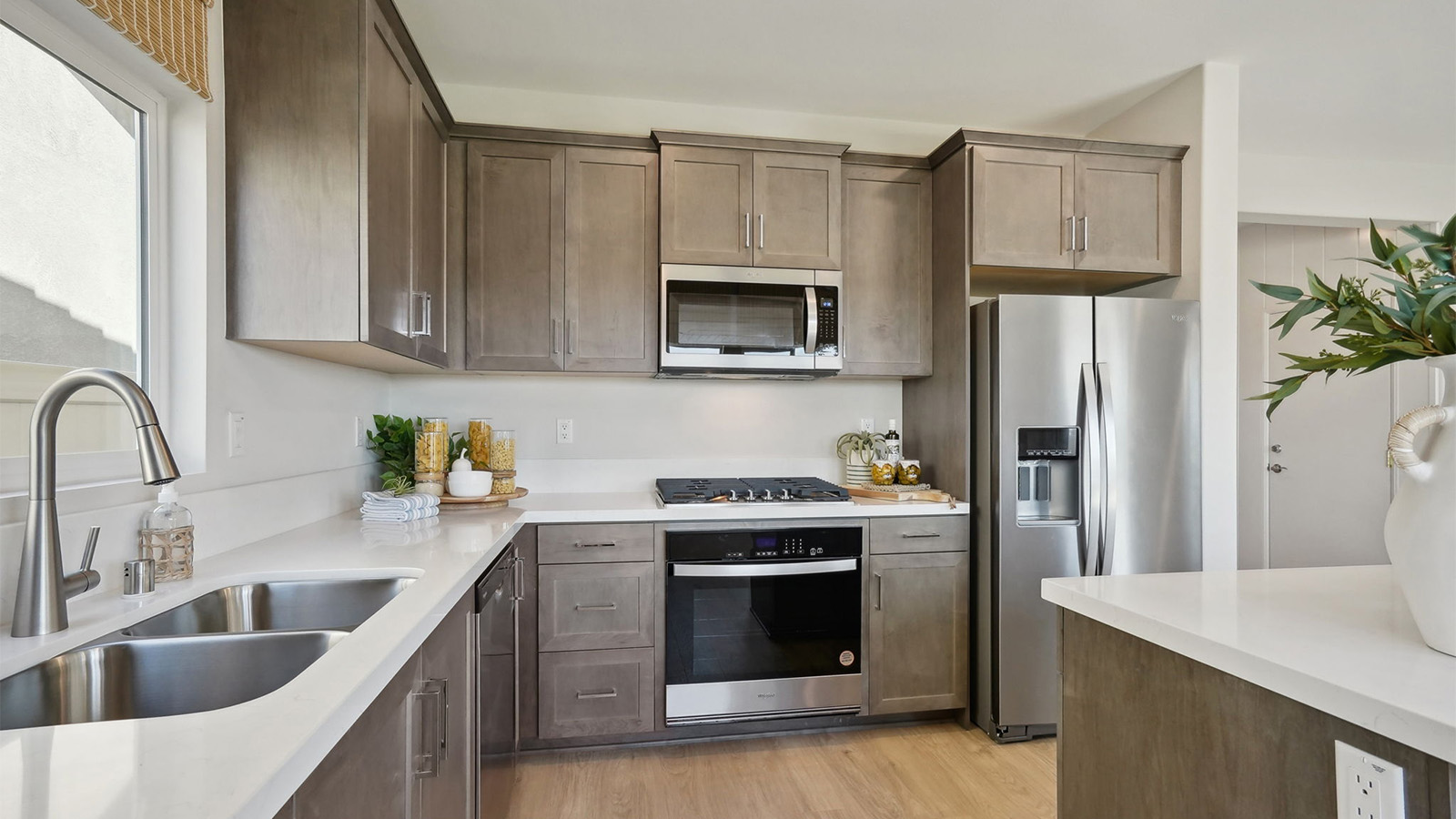 kitchen with dark cabinets and stainless steel appliances