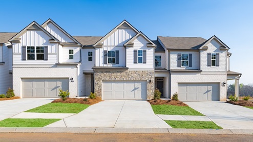 Rosewood Farms Townhome with exterior brick and 2 car garage