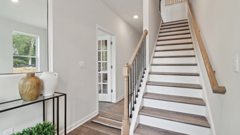 Main level on the townhome with LVP flooring and bedroom on the main