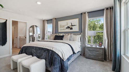 Spacious primary suite with walk in closet and oversized bath