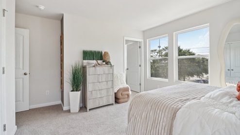 Spacious Bedroom 3 on the main floor with full bath