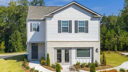 Elston plan with brick exterior and grey siding