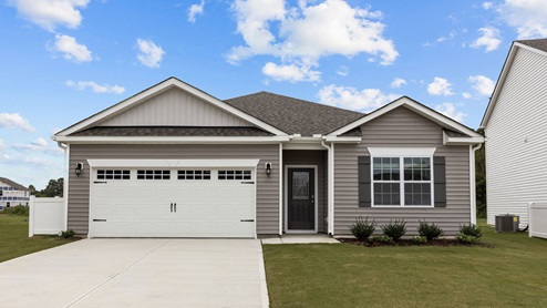 Single story home with two car garage with windows