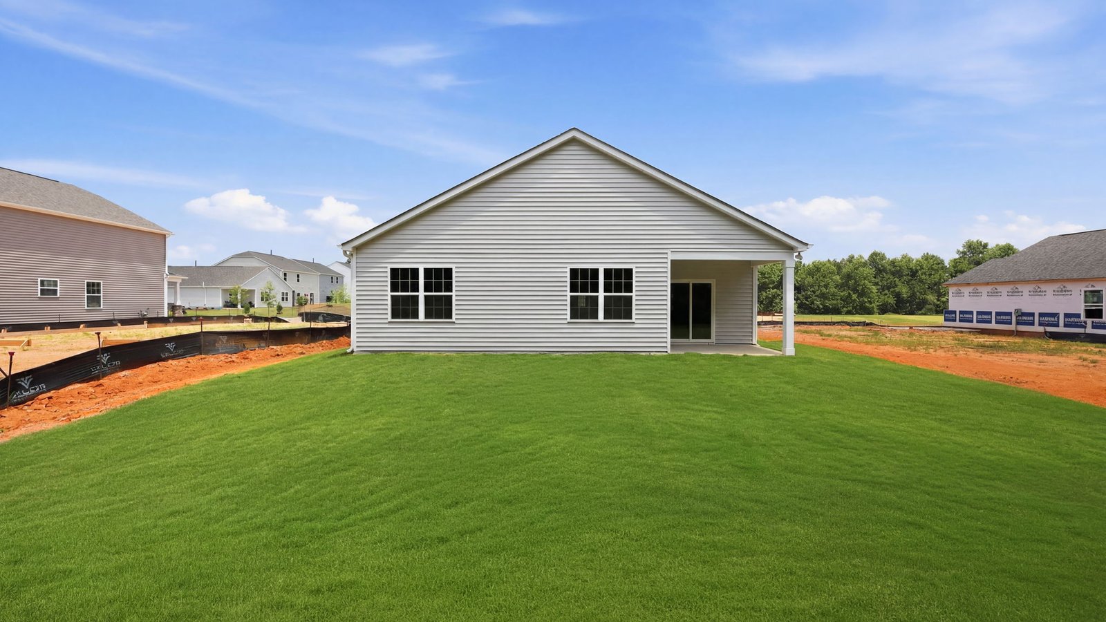 rear view of back yard and covered porch