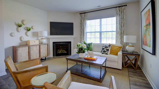 Living room with gas fireplace w/ mantel and slate surround