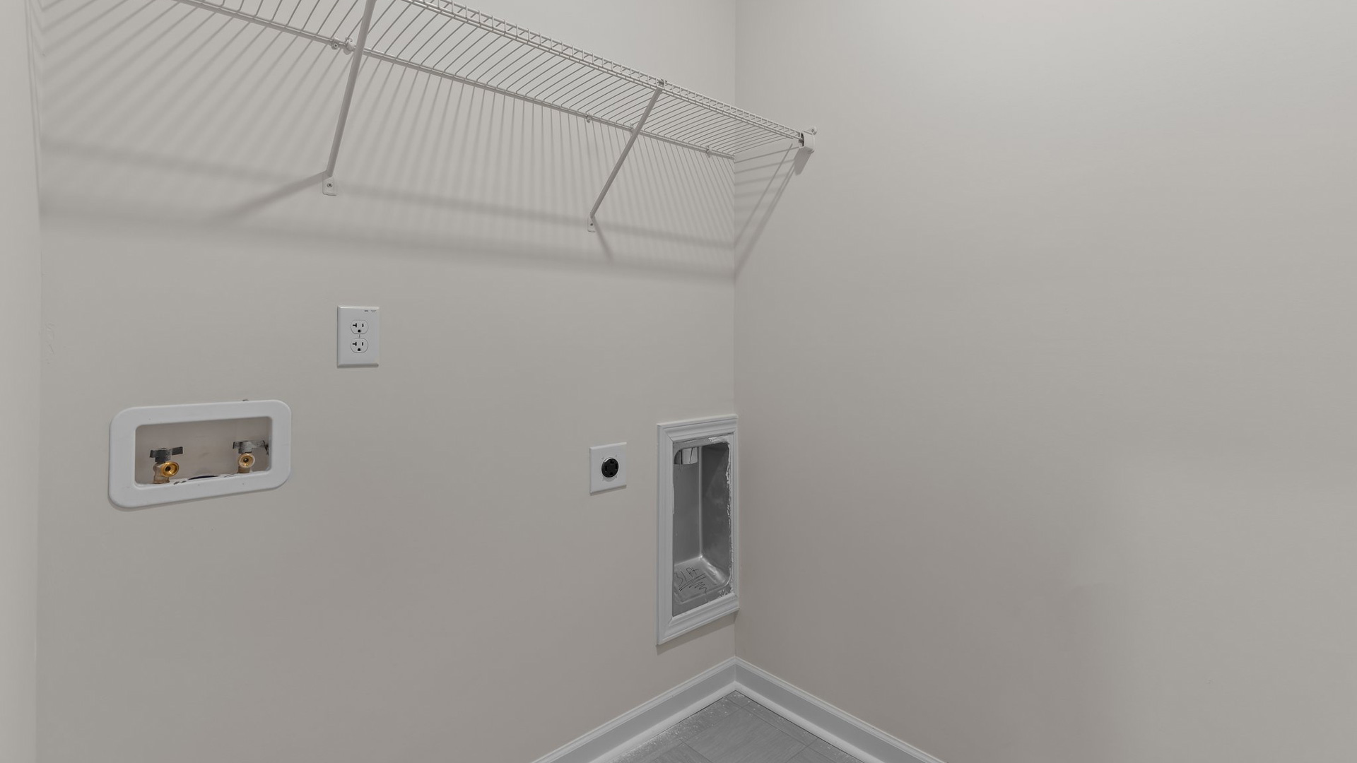 laundry room with wire shelving