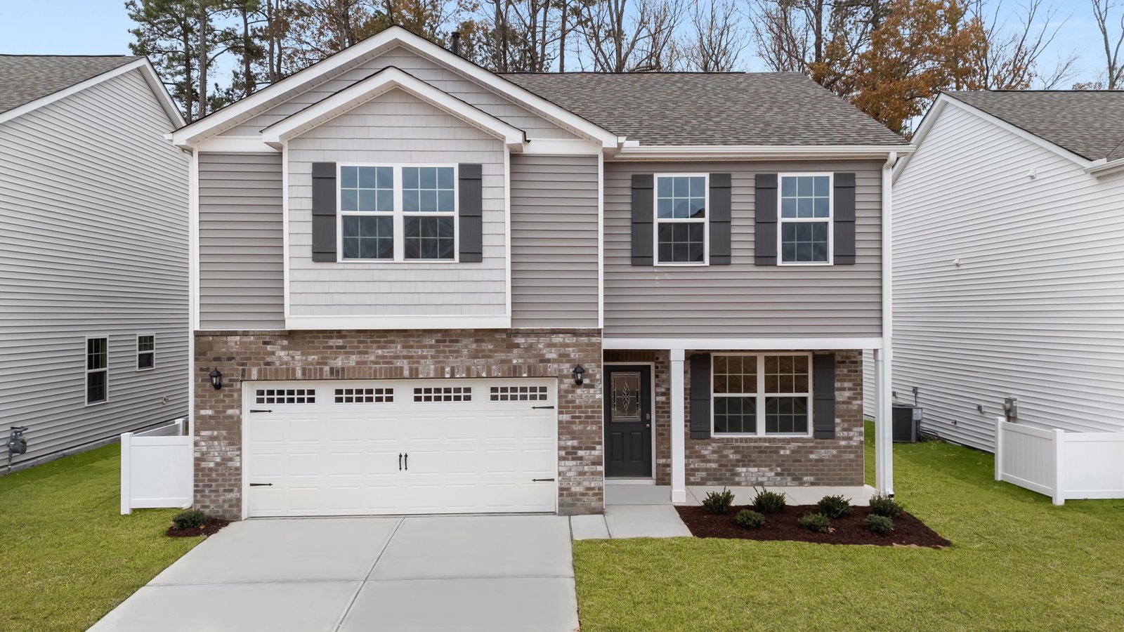 exterior two story home brown with garage