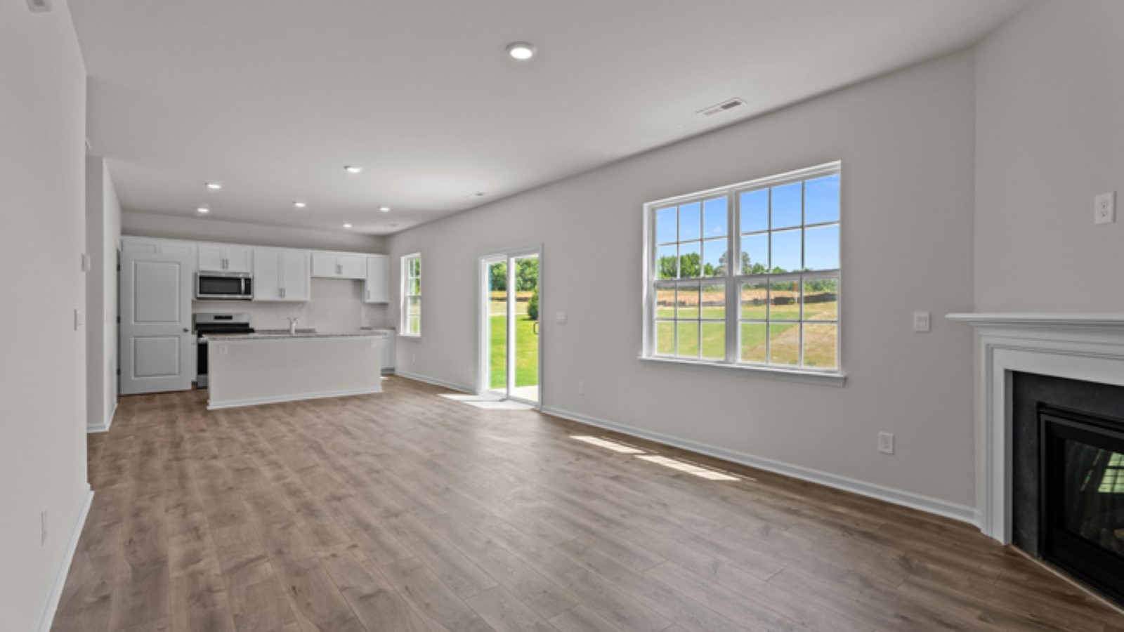 open floorplan with view of kitchen