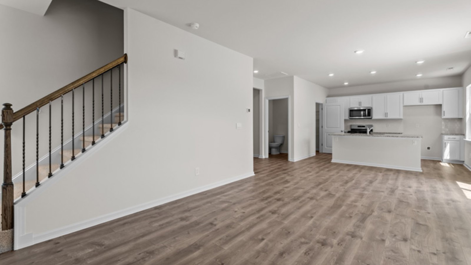 open living area with view of stairs