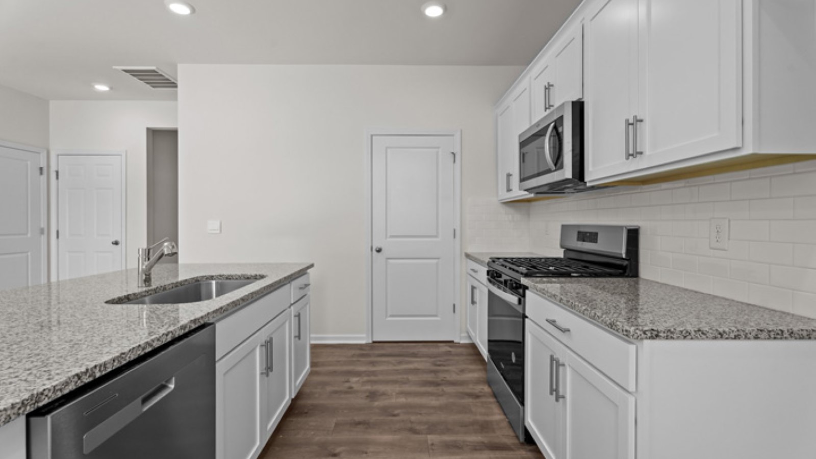 kitchen area with stainless steel appliances and kitchen peninsula