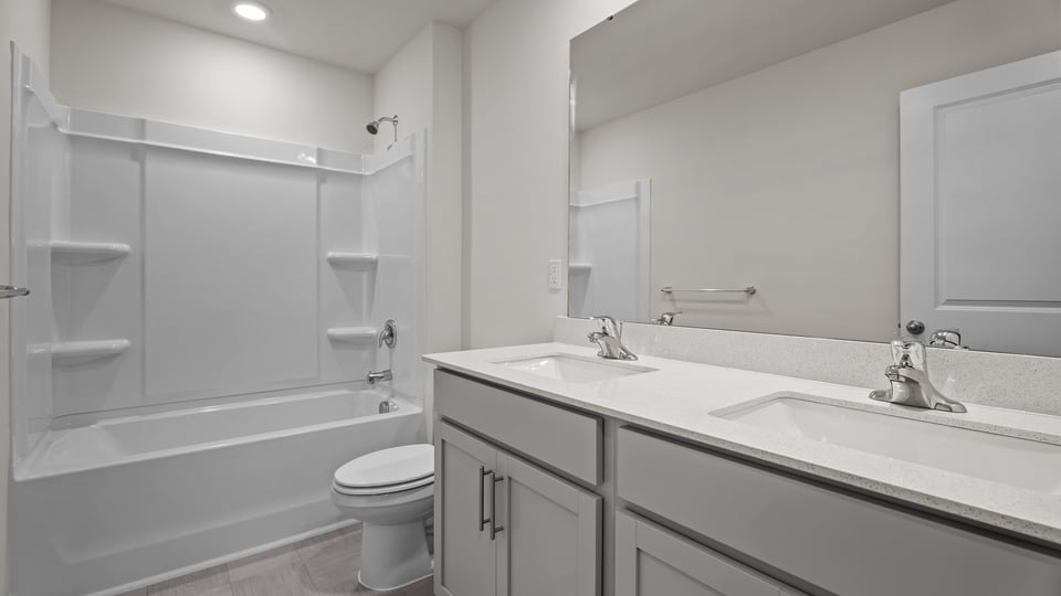 Bathroom with grey cabinets