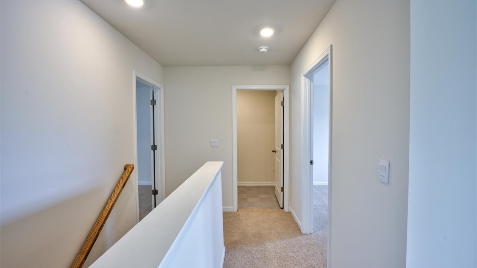 Upstairs entryway with carpet flooring